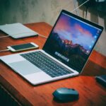 MacBook Pro on brown wooden surface