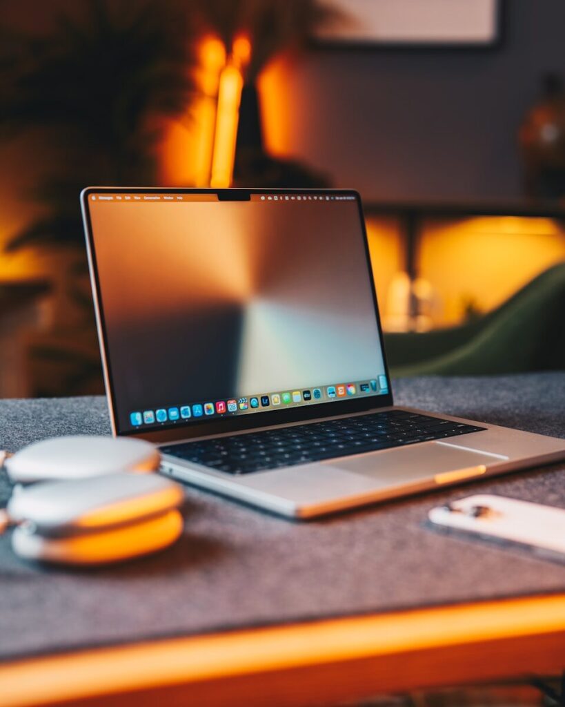 a laptop computer sitting on top of a table